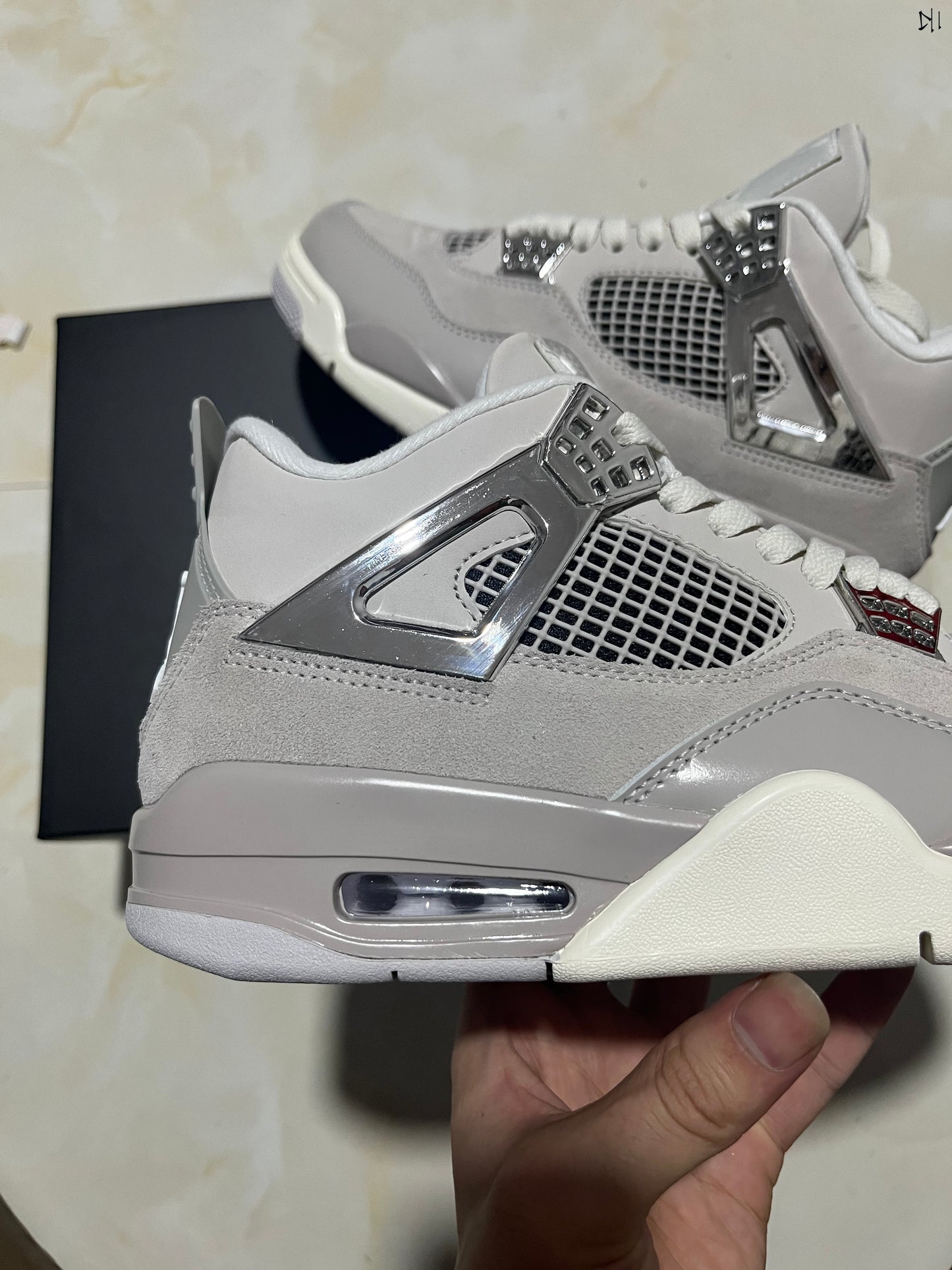 Jordan 4 Frozen Moments