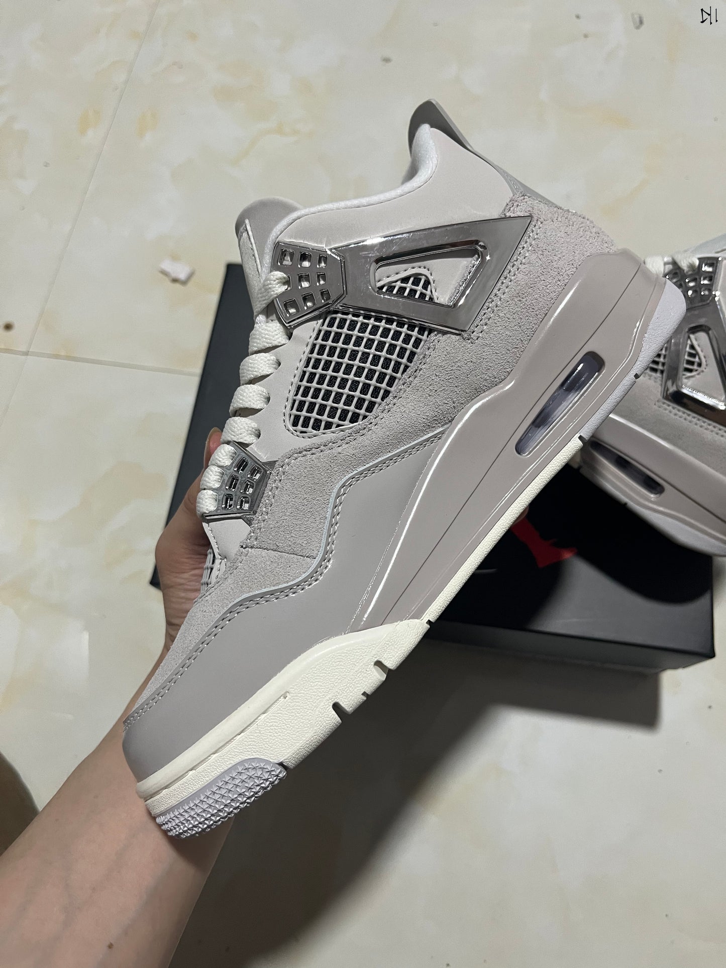 Jordan 4 Frozen Moments
