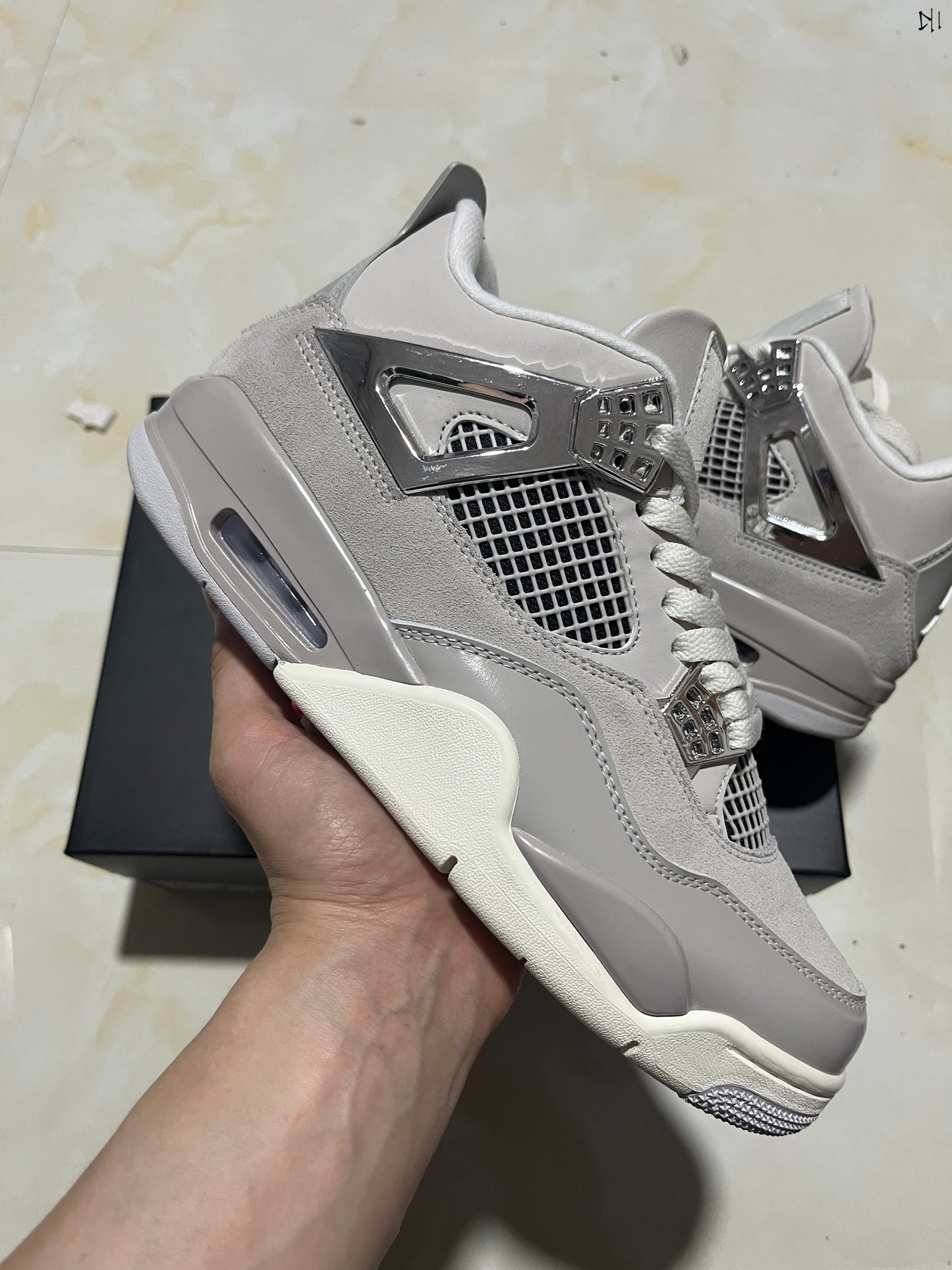 Jordan 4 Frozen Moments